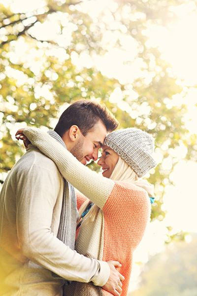 Young romantic couple in the park in autumn